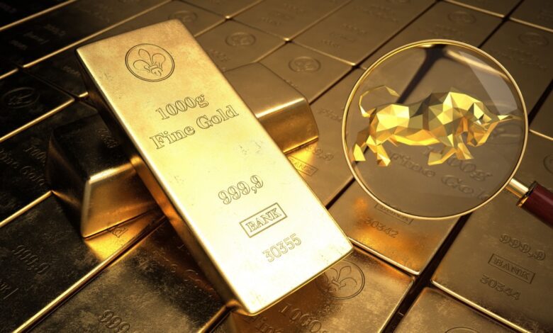 Gold bars with magnifying glass showing golden bull symbol, representing bullish gold market trends and investment optimism in precious metals.
