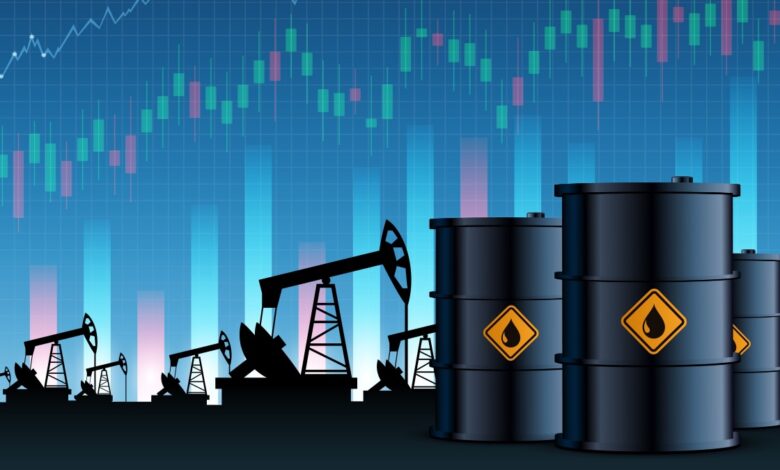 Oil barrels and pumps in front of stock chart background.