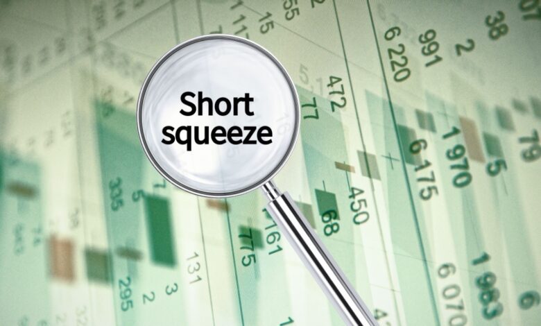 Magnifying glass highlighting the term 'Short squeeze' over a financial stock chart, symbolizing sudden market volatility and investor pressure.