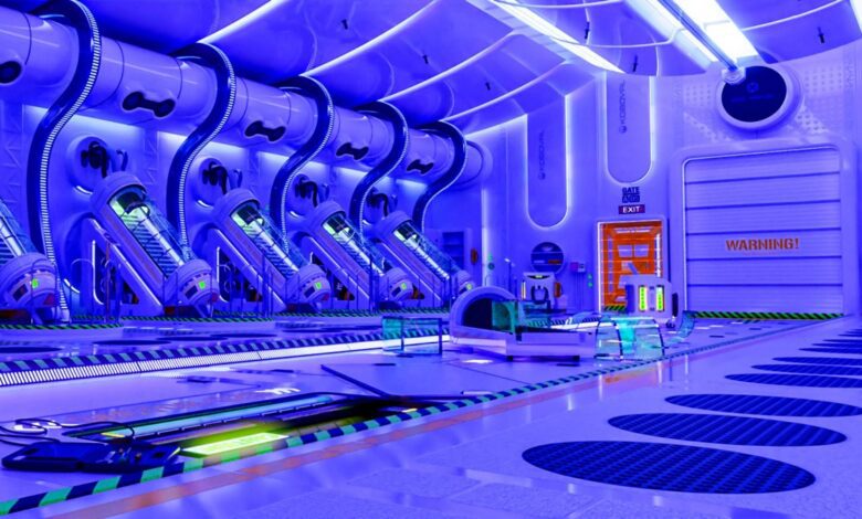 Futuristic sci-fi laboratory interior with glowing blue lighting, featuring multiple cryogenic sleep pods, robotic equipment, warning signs, and high-tech control panels, symbolizing advanced medical technology, space exploration, cryostasis chambers, and artificial intelligence in a sterile sci-fi environment.