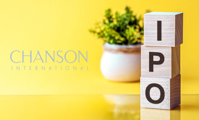 Chanson International Holding IPO concept with wooden blocks stacked vertically spelling 'IPO' next to company name on a bright yellow background, symbolizing initial public offering, stock market debut, corporate finance, and investment opportunity.