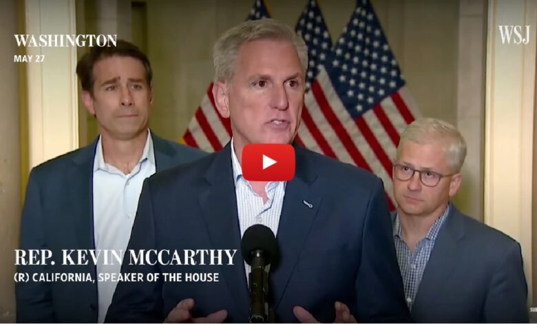 Screenshot of Rep. Kevin McCarthy, Speaker of the House from California, speaking at a press conference with American flags in the background, accompanied by other officials, with WSJ and YouTube play button overlay, symbolizing U.S. political news, government leadership, and legislative updates.