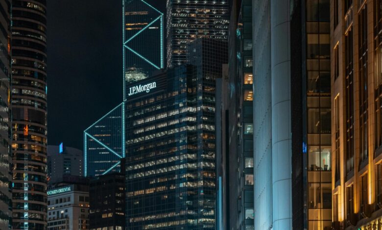 J.P. Morgan office building illuminated at night in a modern city skyline, symbolizing global finance, investment banking, and corporate presence in urban financial districts.