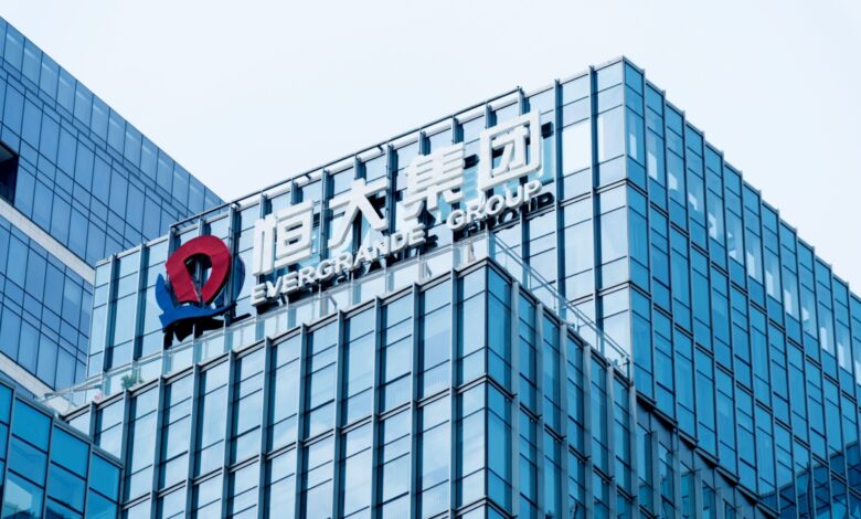 Evergrande Group headquarters building with company logo, representing Chinese real estate giant involved in global debt crisis and financial instability.