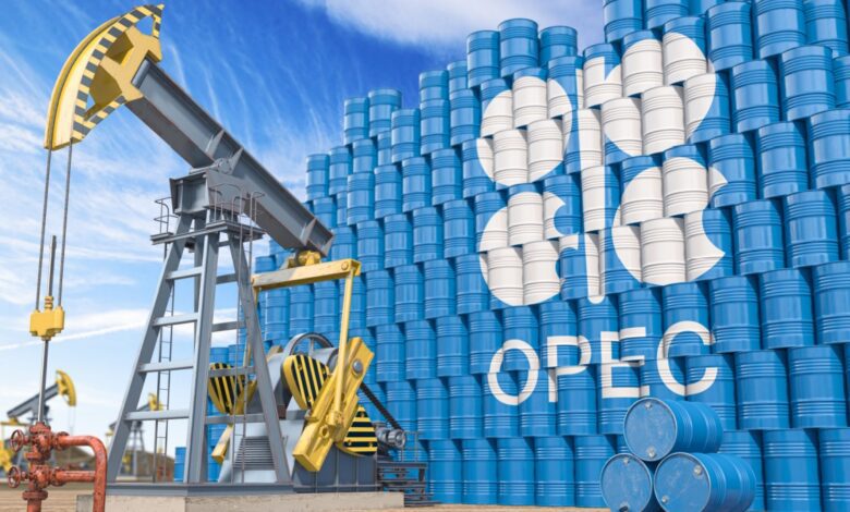 OPEC logo on stack of blue oil barrels next to oil pumpjack.