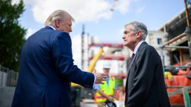 President Trump and Fed Chair Powell at construction site.