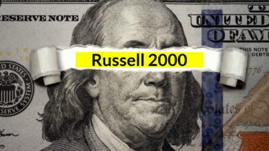 The words "Russell 2000" underneath ripped U.S. dollar bill.